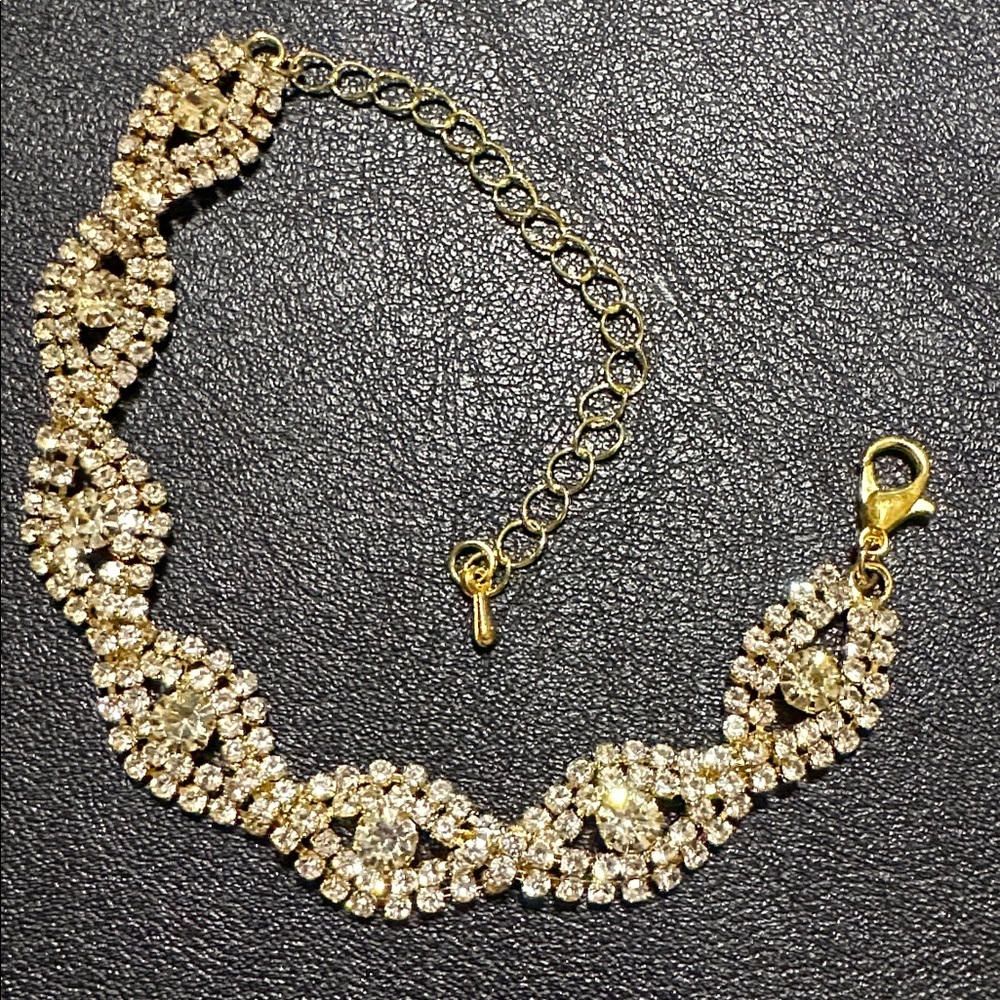 20.  Gold Tone Prong Set Rhinestone Bracelet